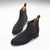 Bottines Chelsea en daim noir, semelle en cuir cousue